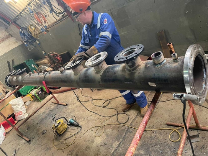 Plant room header with multiple oulets